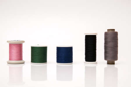 several hanks of yarns on a white background