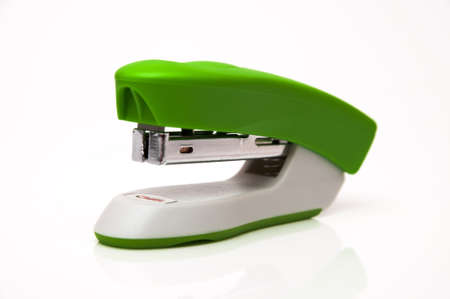 green stapler on a white backgroundの写真素材
