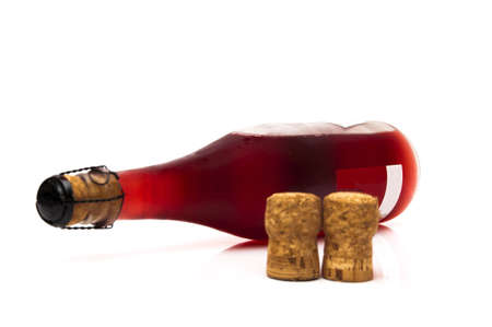 bottle of red wine with two corksの写真素材