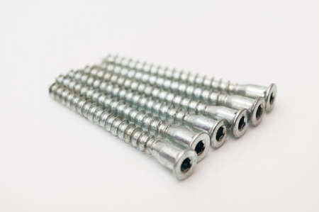silver screws on a white background