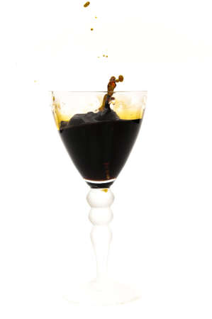 glass with red wine splash on a white background