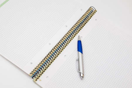 notepad with pen on a white background