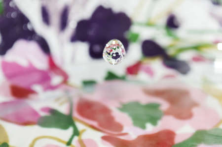 drop of water splashing on a colorful background