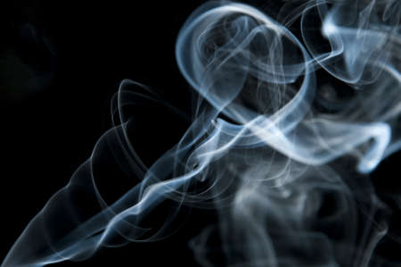 candle smoke odor on a black backgroundの写真素材