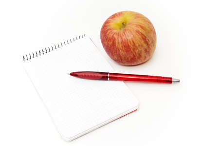 notebook with apple on a white backgroundの写真素材