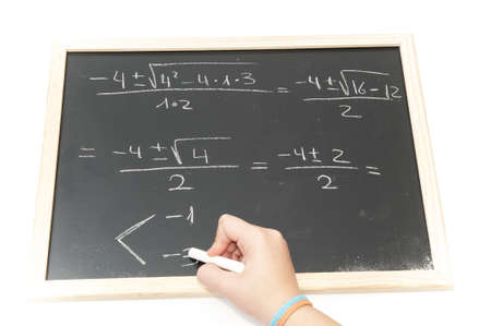 making difficult equations on the blackboard with chalkの写真素材