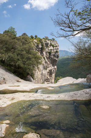 River next to the mountain cliff in Rupitの写真素材