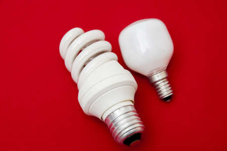 White light bulb on a red background