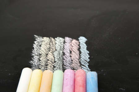 blackboard with chalk in various colors