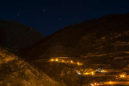 houses on the high mountain with the background stars in Andorra La Vella
