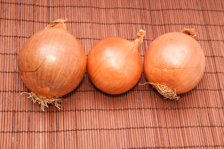 raw onion on a wooden backgroundの写真素材
