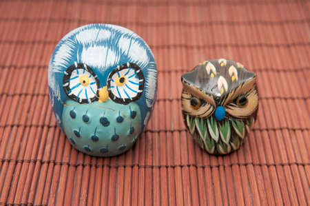 Owls on a wooden backgroundの写真素材