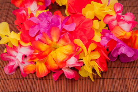 colored flowers on a wooden backgroundの写真素材