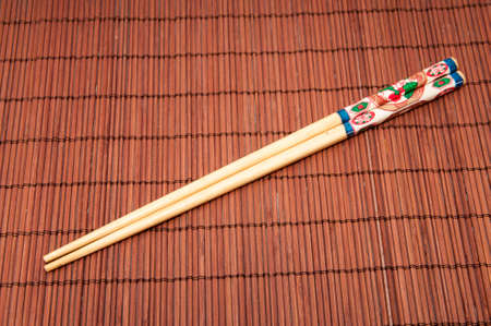 Japanese chopsticks on a wooden backgroundの写真素材