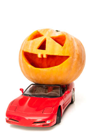 halloween pumpkin with a sports car の写真素材