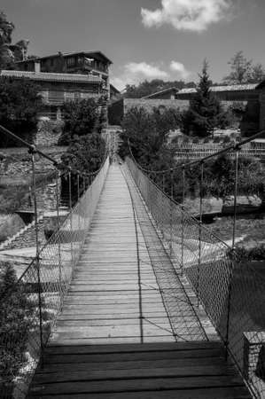 Rupit old suspension bridge on a black and whiteのeditorial素材