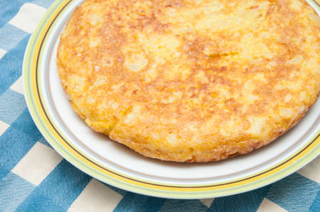 omelette on a blue checked tablecloth