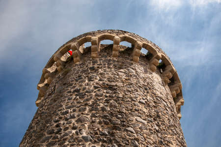 Hostalric stone castle with blue skyのeditorial素材