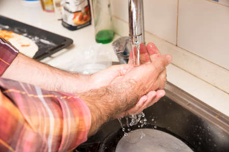 wash hands with soap and waterの写真素材