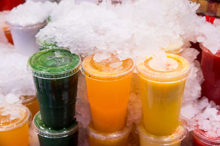 fruit shakes in different flavors and colorsの写真素材