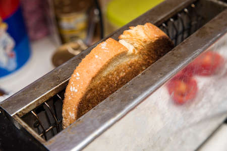 heating toaster toast for breakfastの写真素材