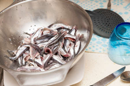 small anchovies cleaning the guts to eatの写真素材