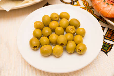 bowl of green olives finished catchingの写真素材