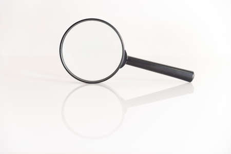 black magnifier on a white backgroundの写真素材