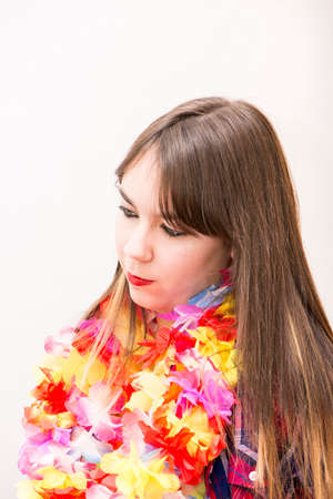 woman with necklace of flowers on a white backgroundの写真素材