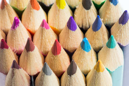 colored pencils on a white background