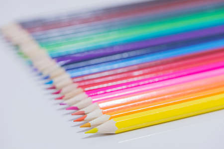 colored pencils on a white background