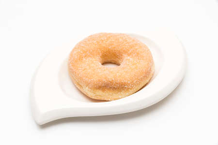 donuts on a plate on a white backgroundの写真素材