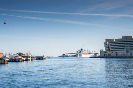 Barcelona harbor where boats are observed and the cityの写真素材
