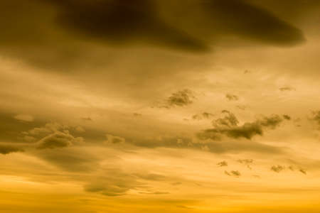 yellow sky with clouds colorの写真素材