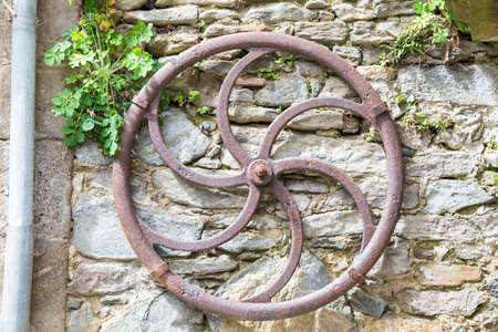 antique iron wheel to draw waterの写真素材