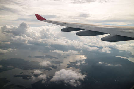 Fly above Hong Kong islands in the cloudsの写真素材