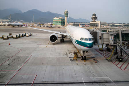 Plane arriving at gate at Hong Kong Airportのeditorial素材