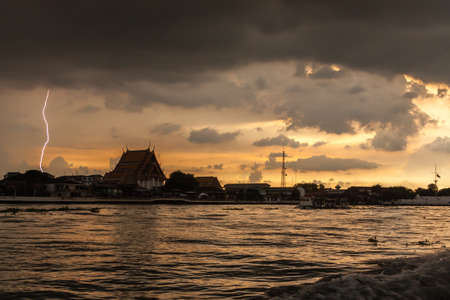 Bangkok summer lightning on the river at sunsetの写真素材