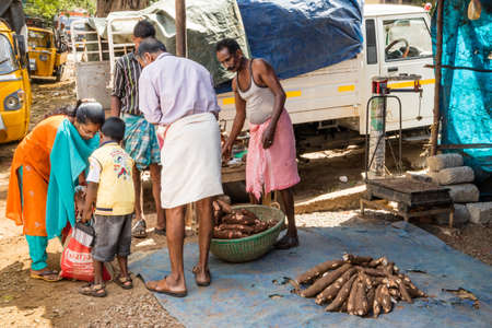 Market selling tapioca to family Kerala, Indiaのeditorial素材