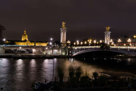 Alexander II bridge and Invalides Museum at night in Parisのeditorial素材