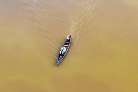 Local rescuer village boat during flooding in Kearala in Indiaの写真素材