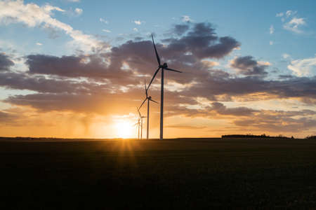 Wind turbine in the field at sunset in France closed to Troyes cityの写真素材