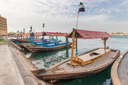 Dubai Creek and its boats for crossingのeditorial素材