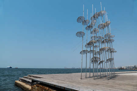 Thessaloniki, Greece, July 15, 2021: this installation of 13 m in height and composed of 40 umbrellas and stainless steel polesのeditorial素材