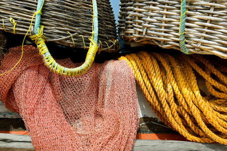 detail of fisherman boat with net and basket