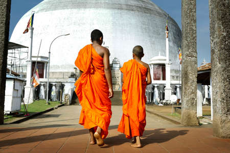 monks coming in ruwanwelisaya stupa in Anuradhapura Historical Park, Sri Lankaの写真素材