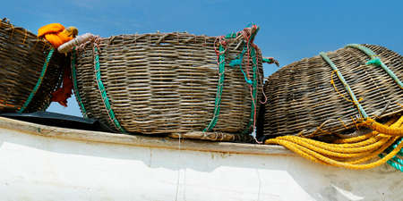 detail of fisherman boat with net and basketの写真素材