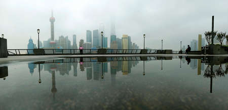 view of Pudong building in Shanghai, China, with refection on water