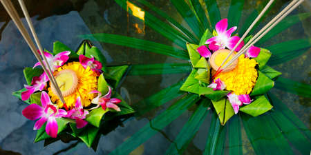 loy krathong, candle in flower's floating basketの写真素材