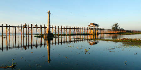 people walking on a bath bridge at Mandalay, Myanmarの写真素材